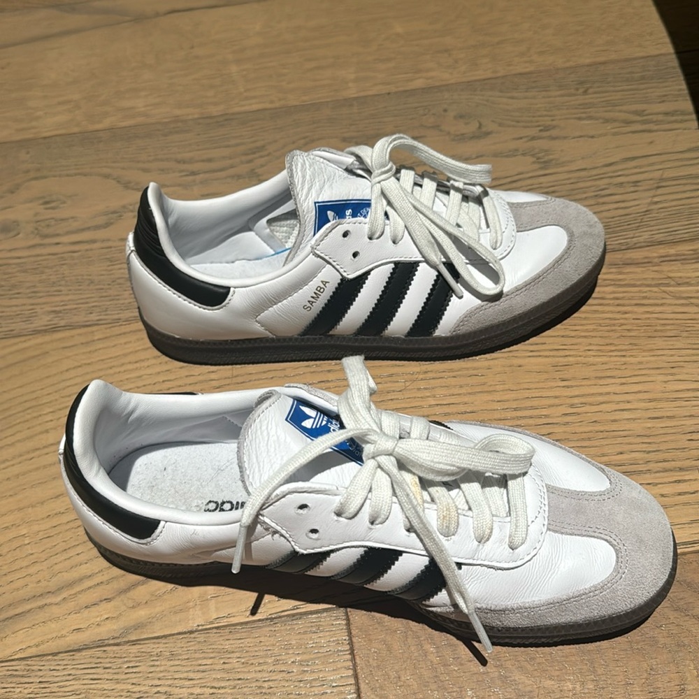 Barley worn white sambas